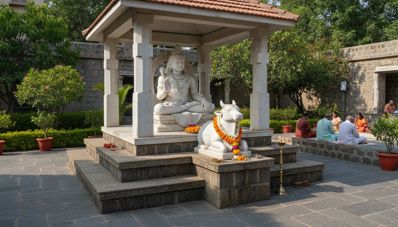 white marble Shiva statue with Nandi placed in temple courtyard outdoor