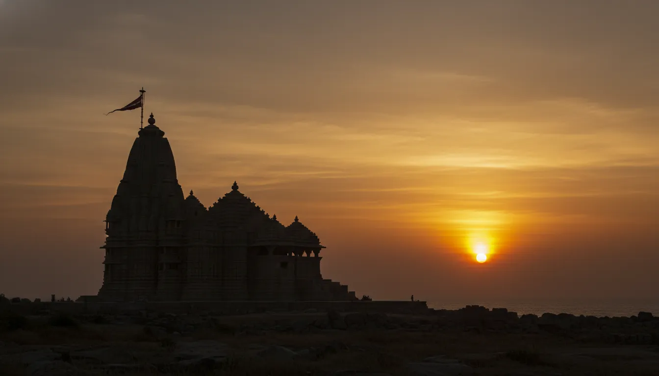 Silhouette of Somnath Mahadev temple against a golden sunrise sky
