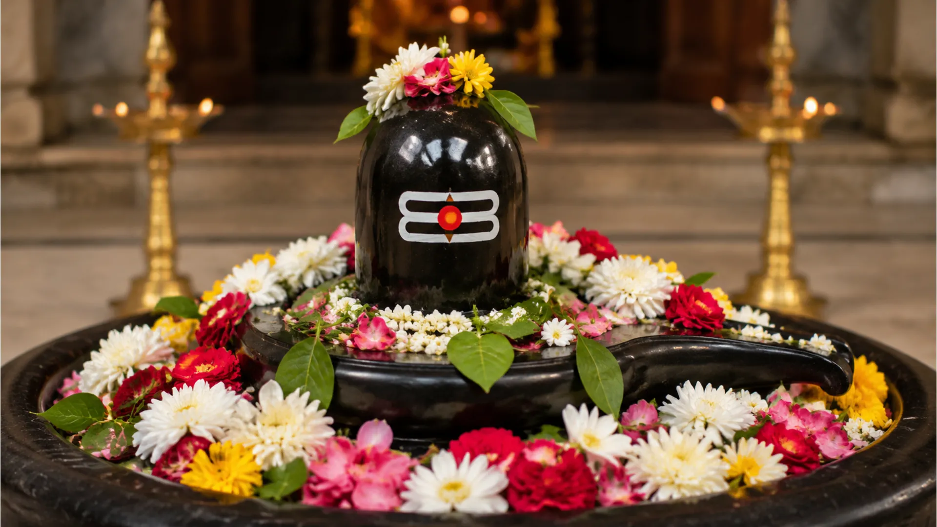 shiva lingam decorated with colorful flowers and leaves for ritual worship