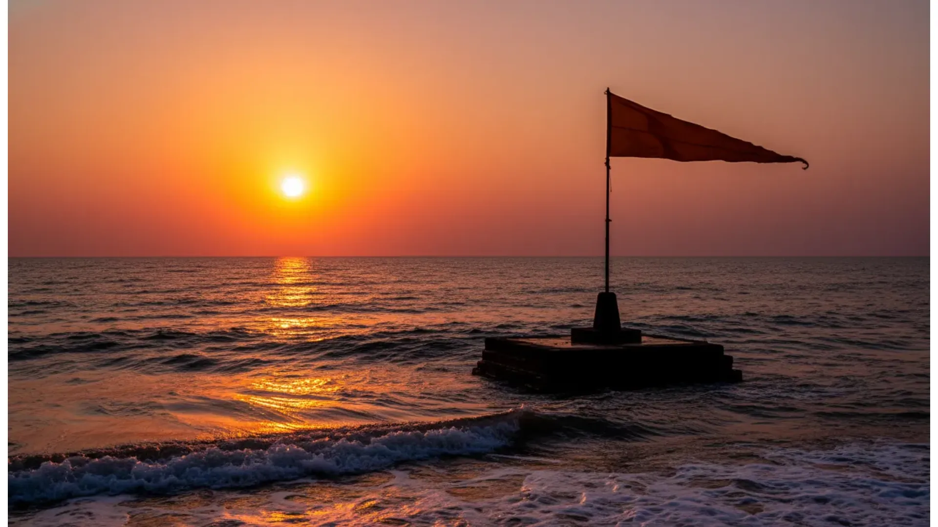 Golden sunset silhouette of the flag and pillar of Nishkalank Mahadev Temple in the sea.