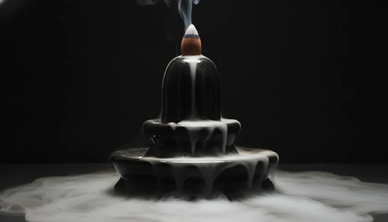 Smoke fountain dhoop cone flowing over a black Shivling