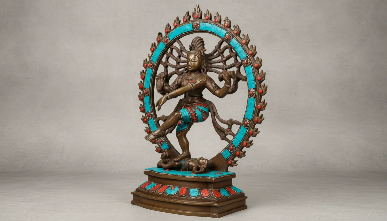 A detailed bronze Nataraja statue decorated with small turquoise and coral gemstone pieces.